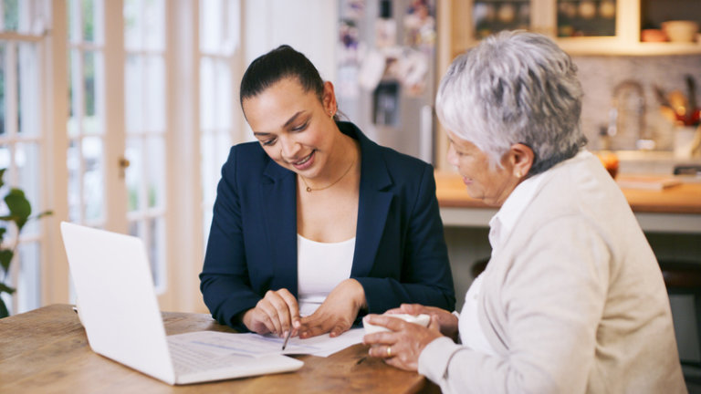 Elderly woman with estate planning attorney