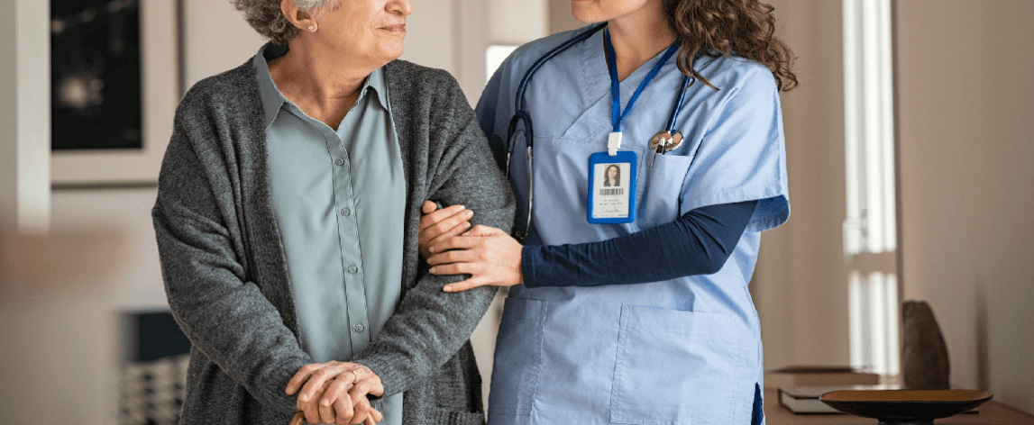 Healthcare worker with elder in nursing home