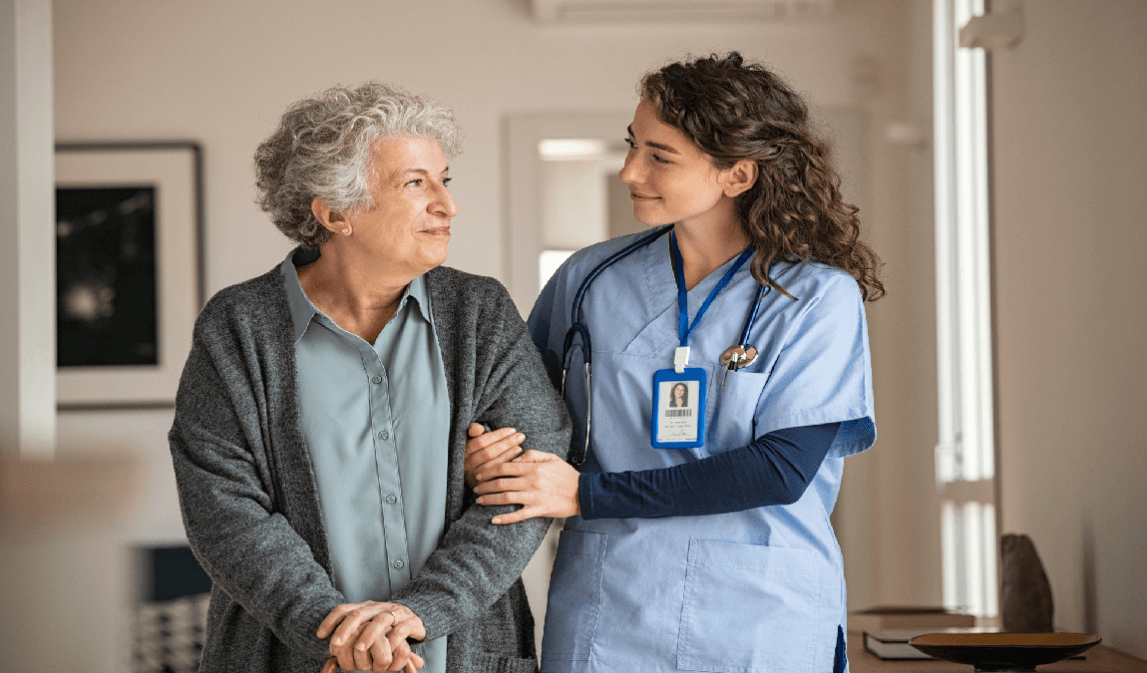 Healthcare worker with elder in nursing home