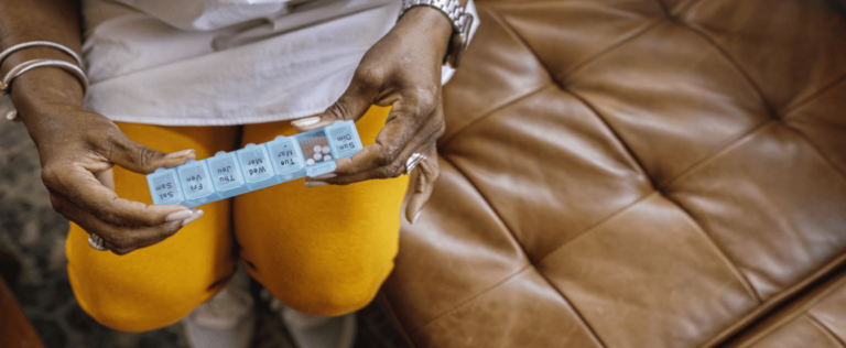 Elder woman with pills from medicaid