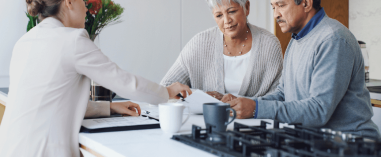 Older couple working with estate planning attorney