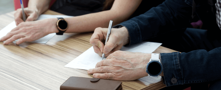 Family signing documents