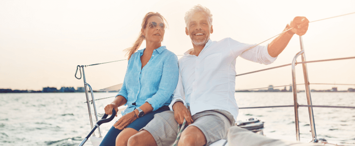 High-net worth couple enjoying their yacht on the open waters.