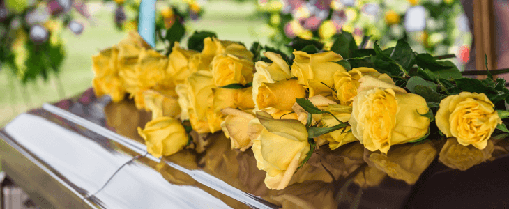 Casket with flowers on top